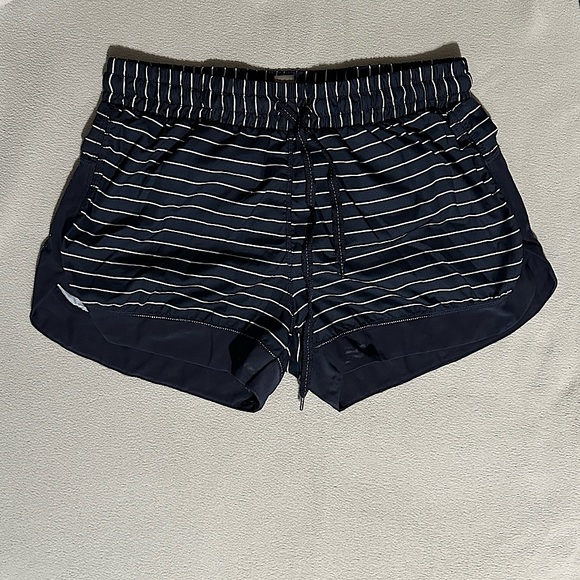 Dip Shorts. Navy Blue with white stripes. Mesh seam at the bottom. - Picture 1 of 2